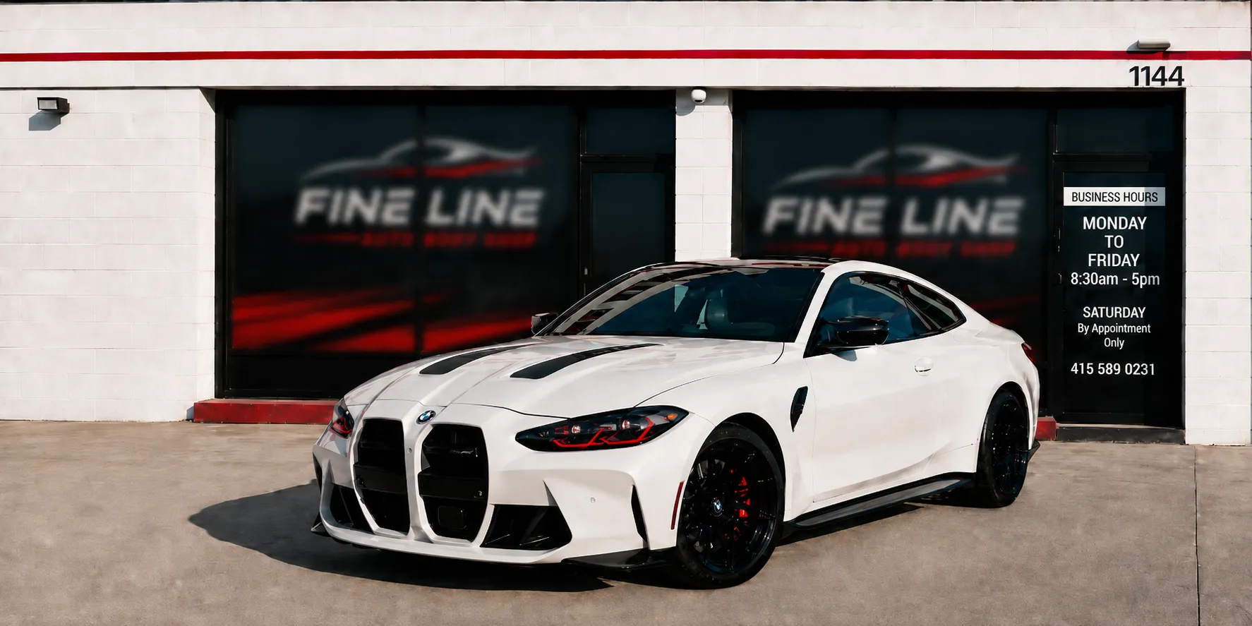 BMW M3 in front of Fine Line Auto Body Shop